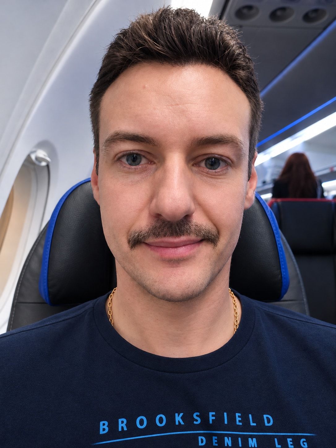 Raphael taking a selfie on board a plane